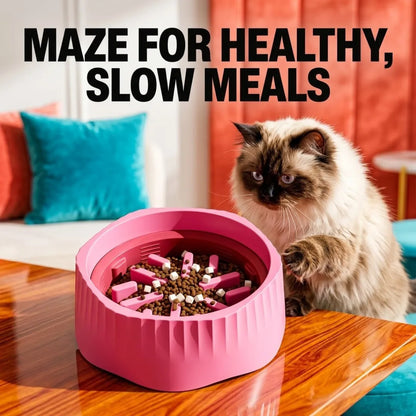 Cat interacting with a pink maze food dispenser on a wooden table.