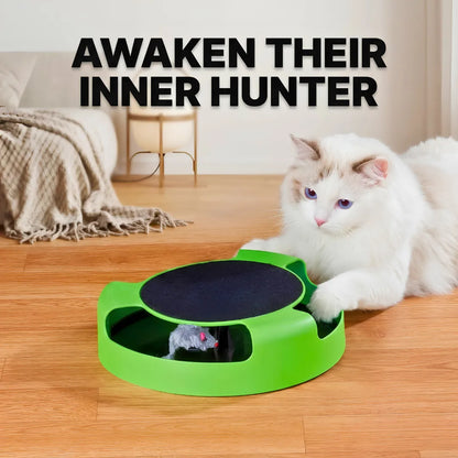 Cat playing with a green and black toy on a wooden floor, with text 'Awaken Their Inner Hunter' above.