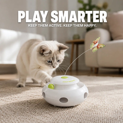 Fluffy white ragdoll cat pushing a green ball inside the track of the FutureFeline automated cat entertainment center.